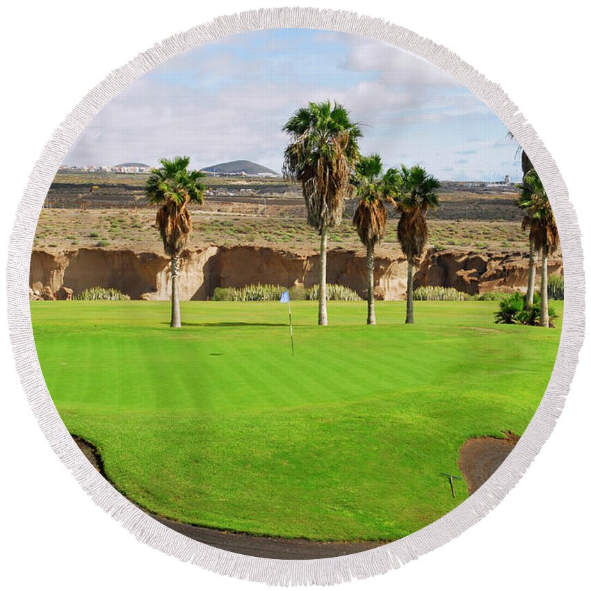 Background Round Beach Towel featuring the photograph Golf course in Tenerife island, Canary islands #1 by Severija Kirilovaite