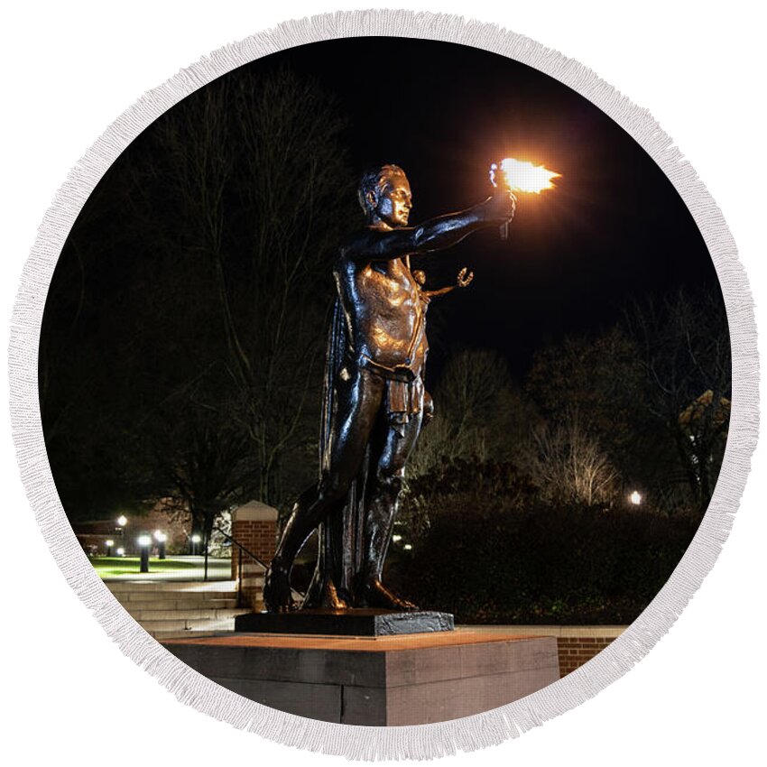 University Of Tennessee At Night Round Beach Towel featuring the photograph Torchbearer statue at the University of Tennessee at night by Eldon McGraw
