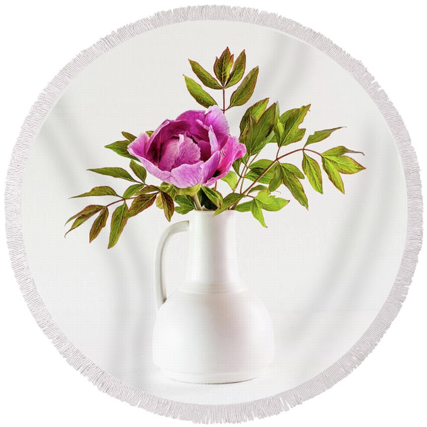 Tree Peony Round Beach Towel featuring the photograph Tree peony Lan He Paeonia suffruticosa rockii in a white vase by Torbjorn Swenelius