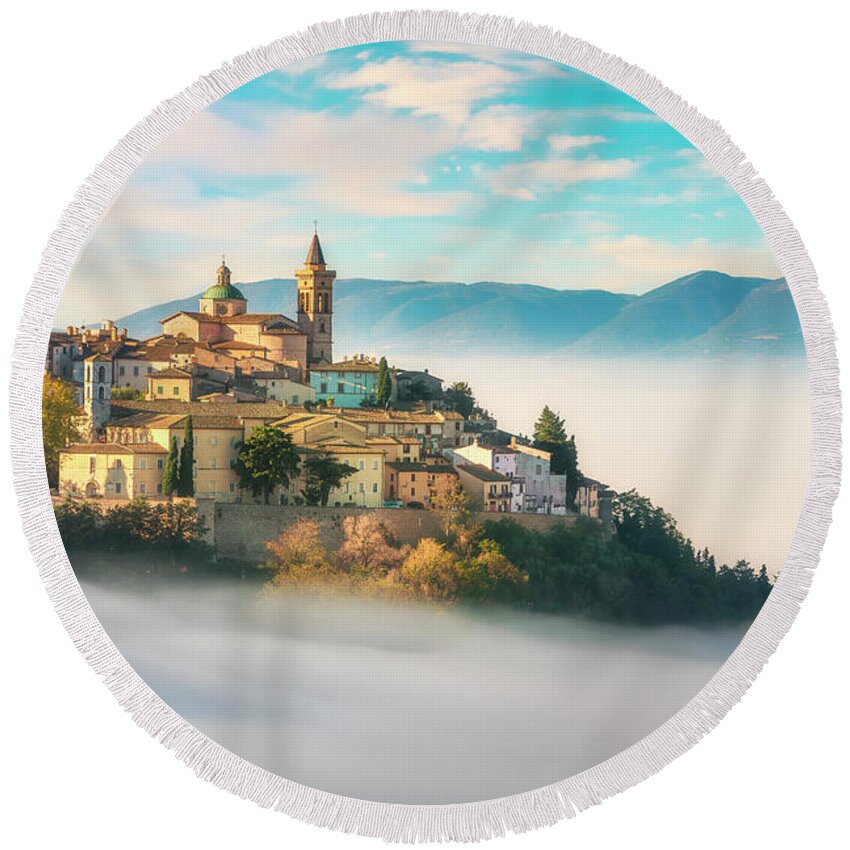 Trevi Round Beach Towel featuring the photograph Trevi picturesque village in a foggy morning. Perugia, Umbria, I by Stefano Orazzini