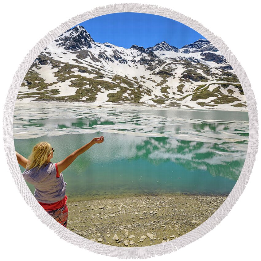 Switzerland Round Beach Towel featuring the photograph woman on Swiss White lake trekking #1 by Benny Marty