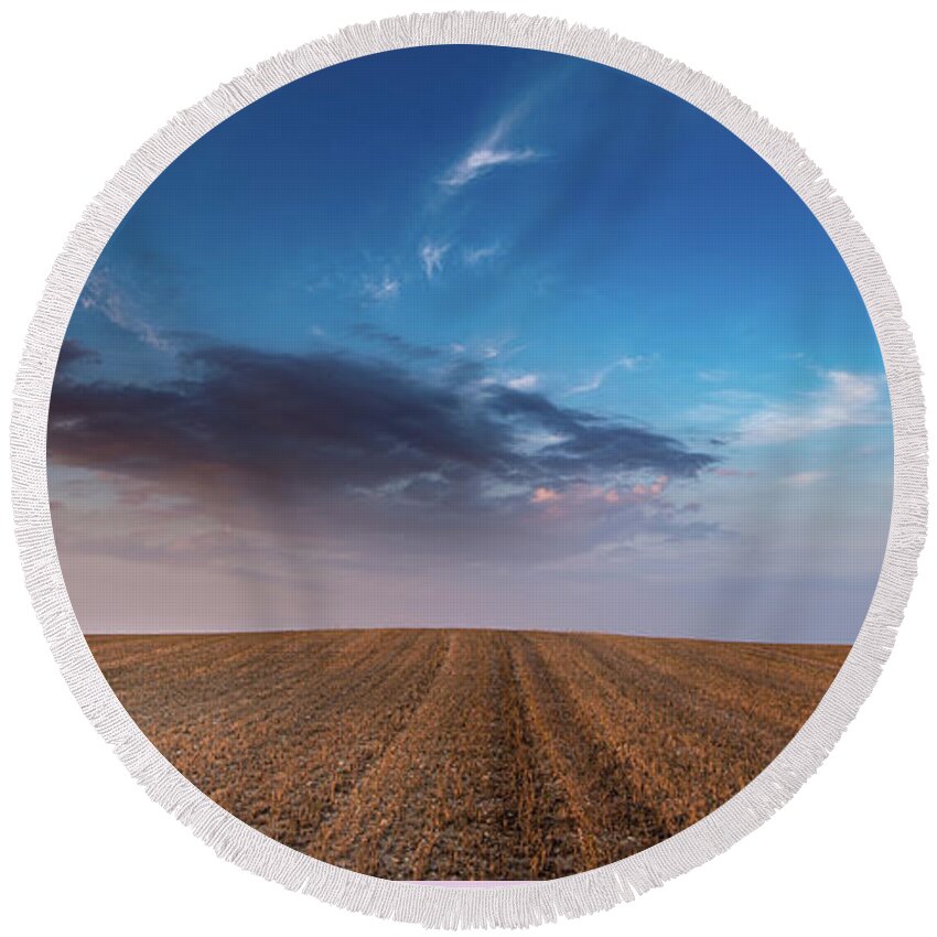 Nightfall Round Beach Towel featuring the photograph Agricultural meadow field and cloudy sky during sunset. by Michalakis Ppalis