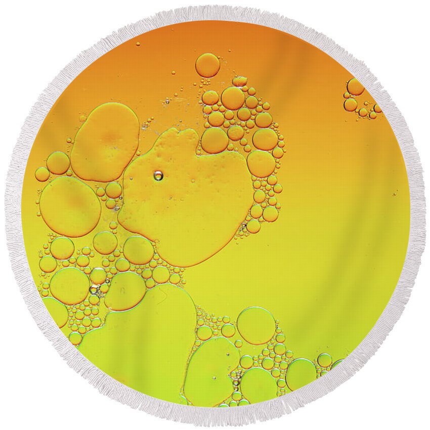 Connection Round Beach Towel featuring the photograph Bright abstract, yellow background with flying bubbles by Michalakis Ppalis