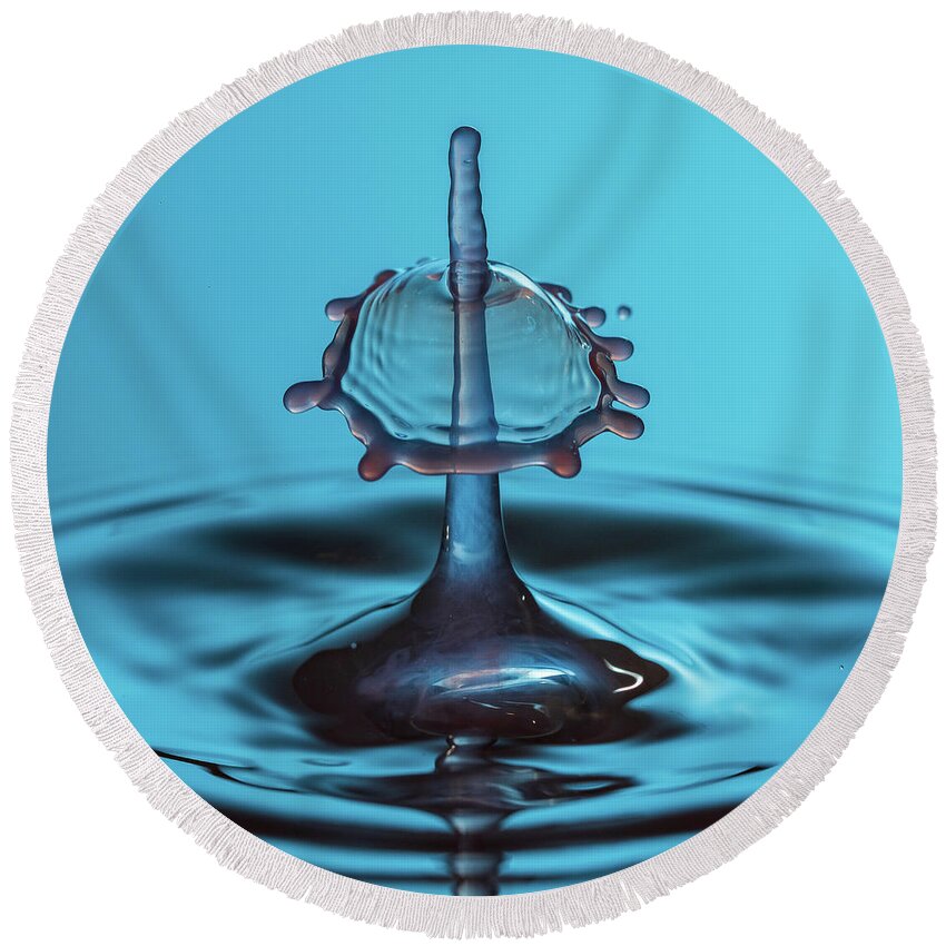 Waterdrop Round Beach Towel featuring the photograph Water drop falling onto column of water by Steven Heap