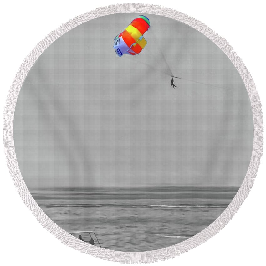 Selective Colour Round Beach Towel featuring the photograph A selective colour photograph of a paragliding Benidorm beach-Spain by Pics By Tony