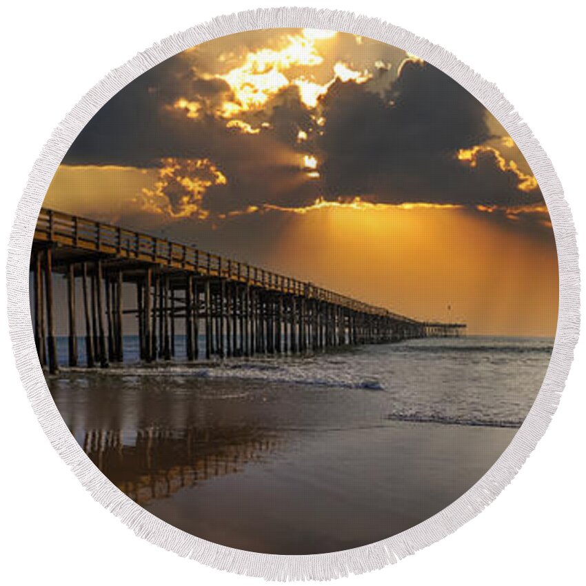 Sunset Round Beach Towel featuring the photograph A Sunset at the Pier by Marcus Jones