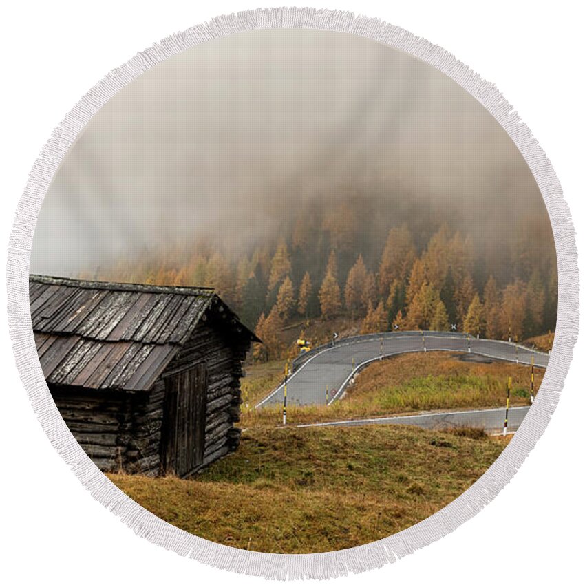 Passo Gardena Round Beach Towel featuring the photograph Autumn landscape with wooden chalet dolomiti Italian Apls by Michalakis Ppalis