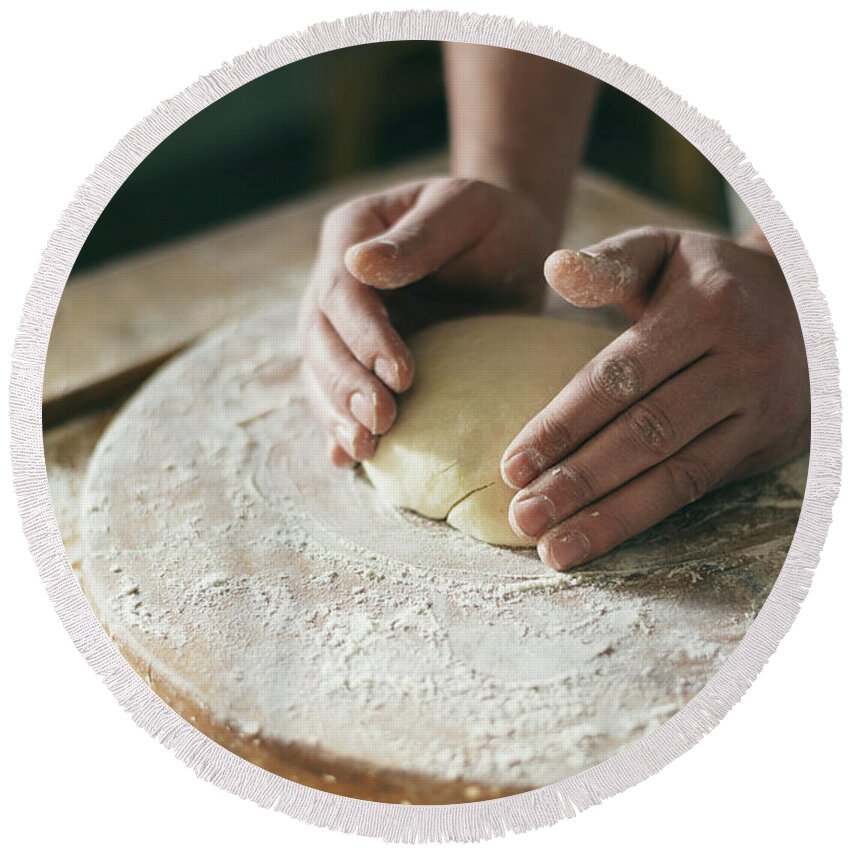 Baker Round Beach Towel featuring the photograph Baker preparing dough closeup by Jelena Jovanovic