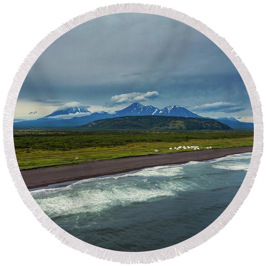 Beach Round Beach Towel featuring the photograph Beach with black sand and volcano by Mikhail Kokhanchikov