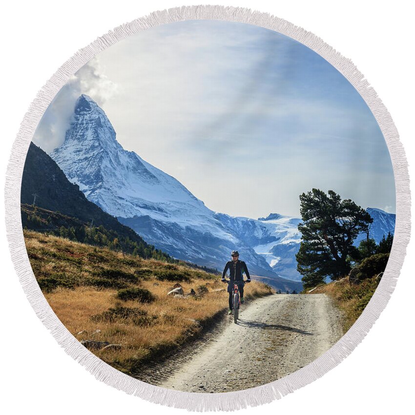 Alps Round Beach Towel featuring the photograph Bicycling in the Alps by Alexey Stiop