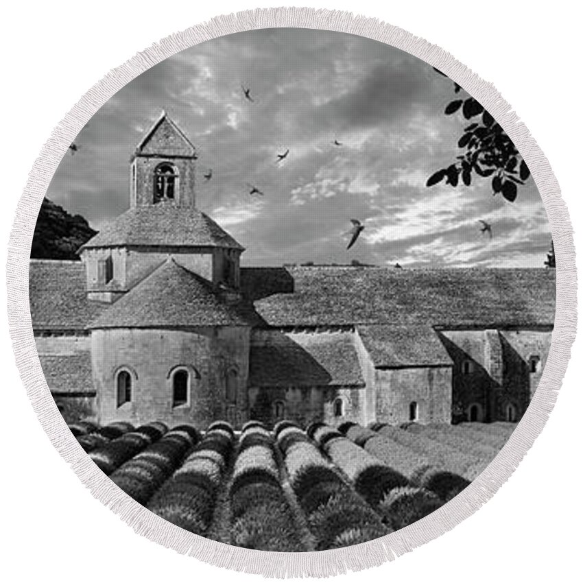 Senanque Abbey Round Beach Towel featuring the photograph Sacred Stone - Black and white photo of the Romanesque Senanque Abbey by Paul E Williams