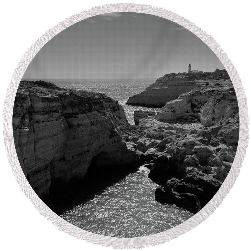 Algarve Round Beach Towel featuring the photograph Carvoeiro lighthouse and cliffs by Angelo DeVal