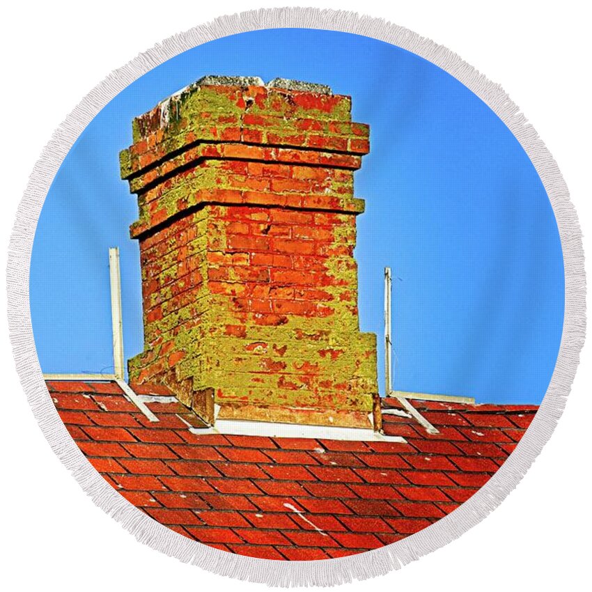Standing; Chimney; Roof; Peak; Spire; Steeple; Aqua; Black; Blue; Blue Sky; Green; Red; Alone; Old; Rough; Worn; Worn Out; Fungus; Moss; Mold; Bright; Sunny; Sunshine; Bird Droppings; Brick; Droppings; Hard; Metal; Shingle; Surface; Texture; Tile; Above; Building; Close Up; High; House; Sky; Block; Elongated; Layered; Pattern; Peaked; Protruded; Rectangle; Repeated; Sloped; Square; Steep; Terraced; Vertical; Day; Clear Round Beach Towel featuring the photograph Chimney On Blue by David Desautel