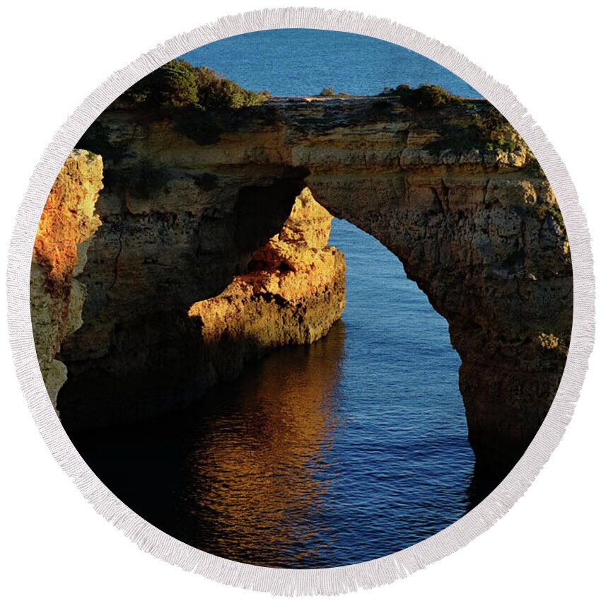 Algarve Round Beach Towel featuring the photograph Cliff Arch in Albandeira Beach during Sunset 2 by Angelo DeVal