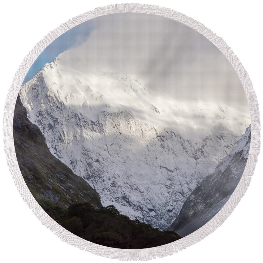 Milford Sound Round Beach Towel featuring the photograph Clouds and Snow around Milford Sound One by Bob Phillips