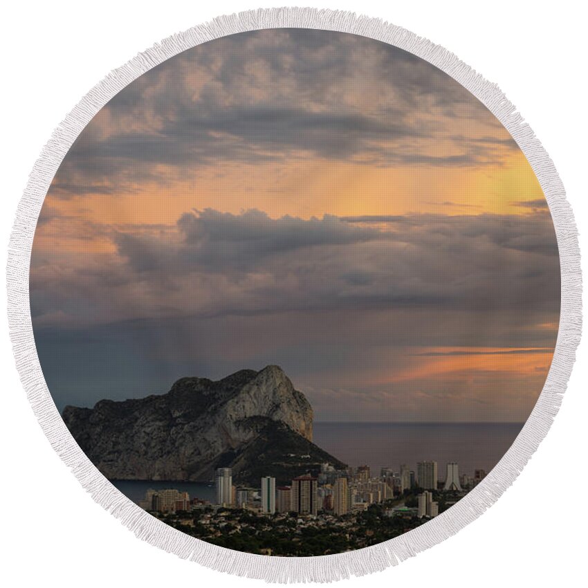 Sunset Round Beach Towel featuring the photograph Clouds on the Mediterranean coast in Calpe by Adriana Mueller