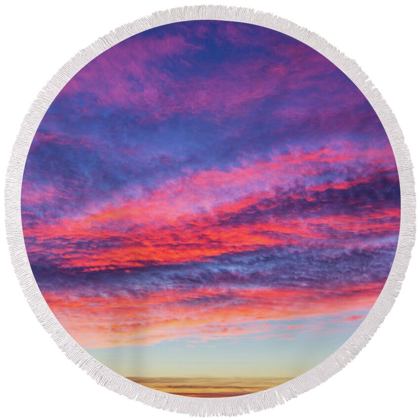 Sunset Round Beach Towel featuring the photograph Colorful cloudscape at sunset by Fabiano Di Paolo