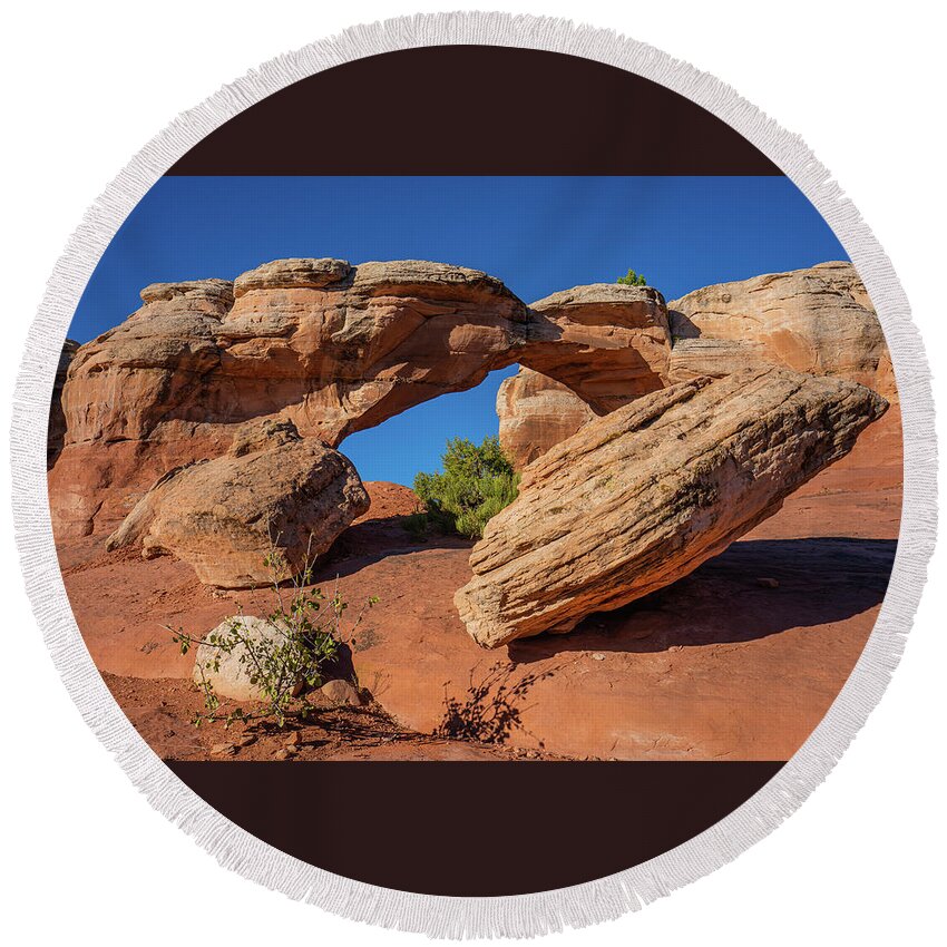 Arches National Park Round Beach Towel featuring the photograph Defying Gravity by Ron Long Ltd Photography
