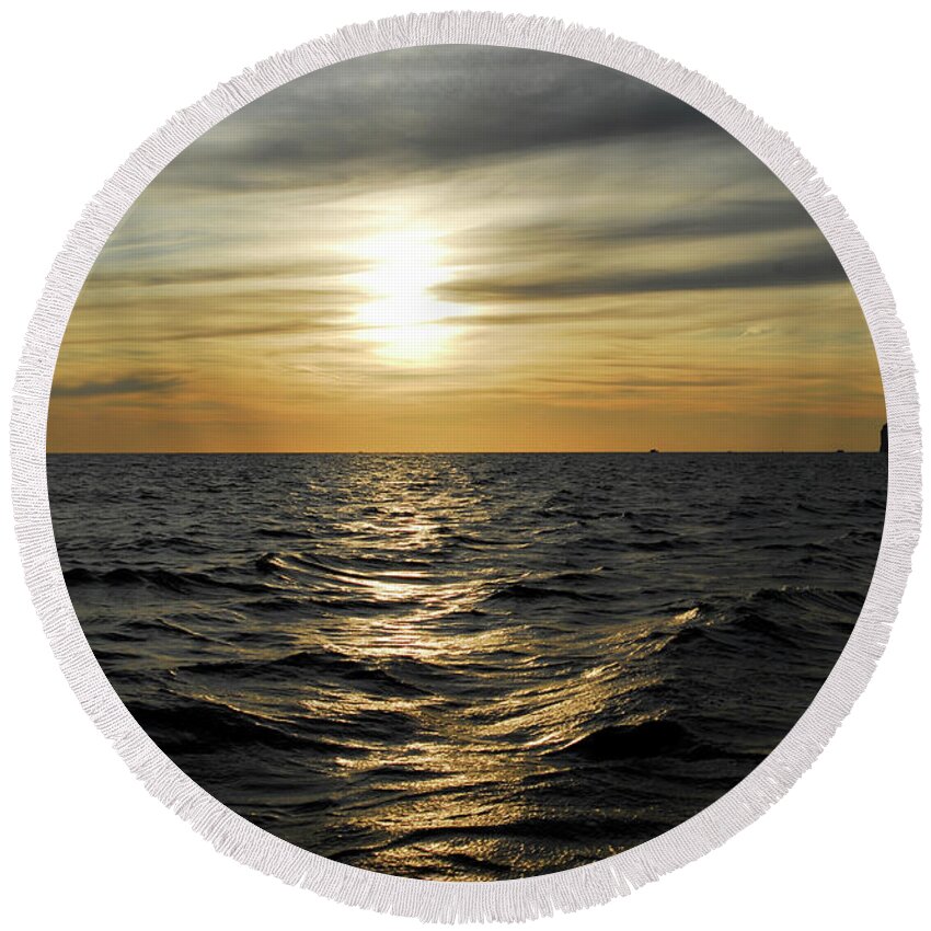 Tranquil Round Beach Towel featuring the photograph Dramatic sunset in the sea by Severija Kirilovaite