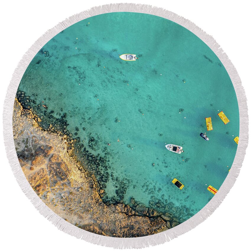 Seascape Round Beach Towel featuring the photograph Drone aerial of seascape with idyllic blue calm blue water. Fig tree bay beach Protaras Cyprus by Michalakis Ppalis