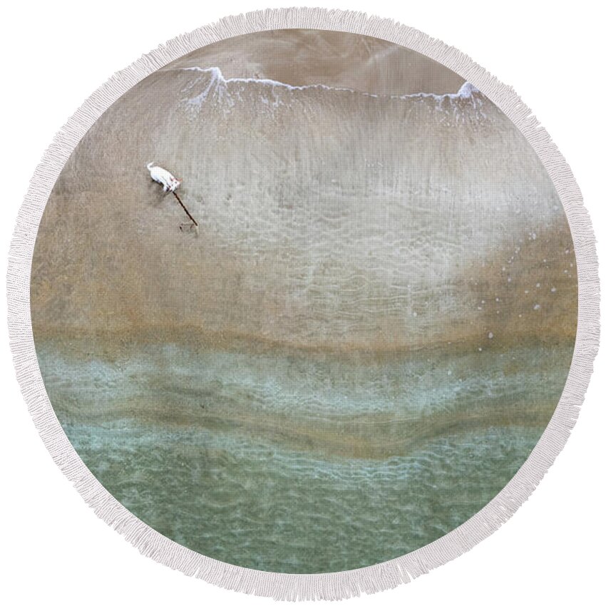 Animal Running Round Beach Towel featuring the photograph Drone aerial of white Dog running and playing at empty sandy beach by Michalakis Ppalis