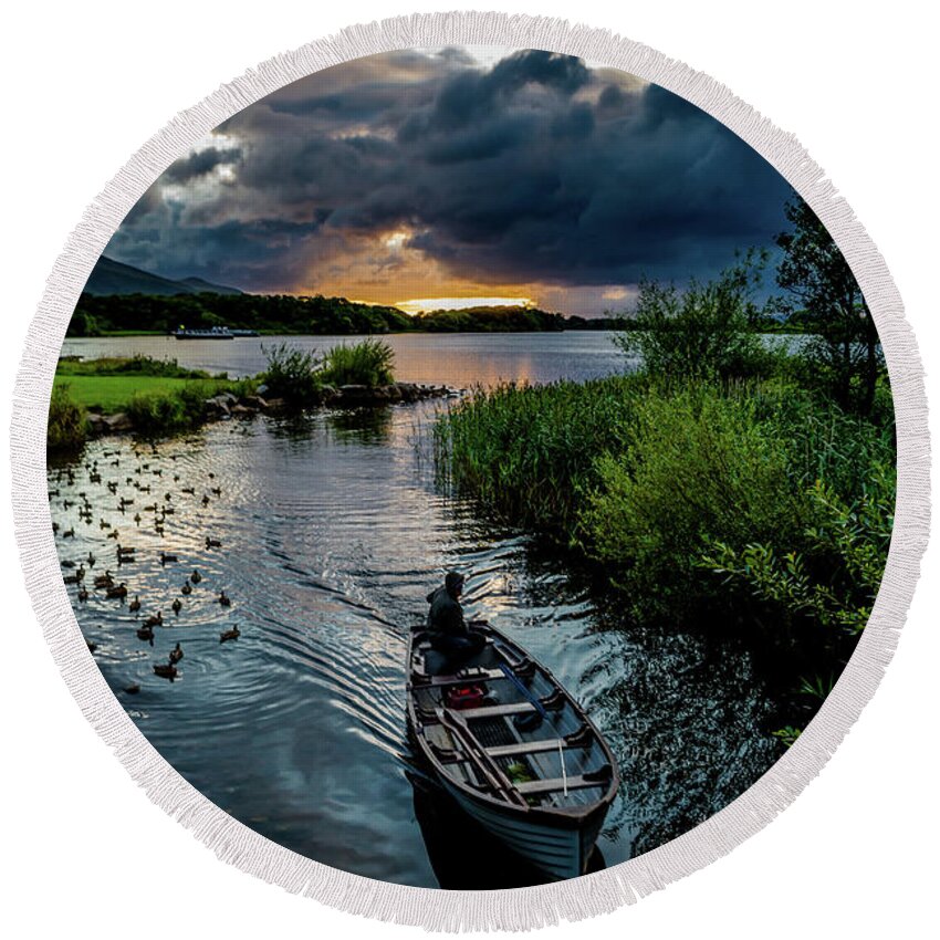 Ireland Round Beach Towel featuring the photograph Fisher boat returns at sunset from Lough Leane in Killarney National Park in Ireland by Andreas Berthold
