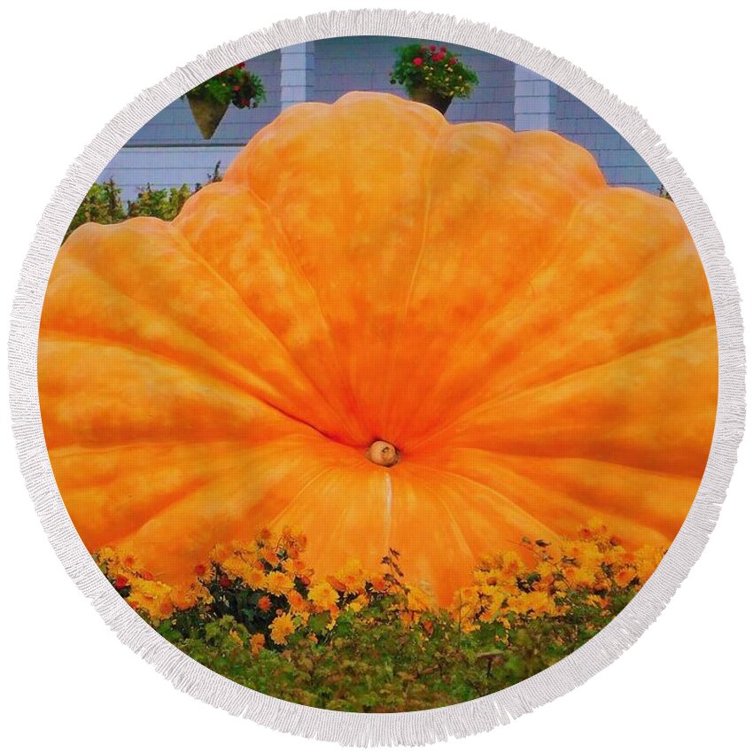 - Giant Pumpkin Round Beach Towel featuring the photograph - Giant Pumpkin by THERESA Nye