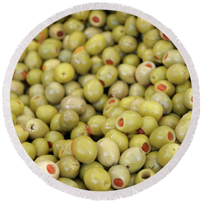 Market Round Beach Towel featuring the photograph Green olives with pimentos been sold in bulk, Lourmarin, France by Kevin Oke
