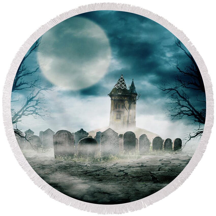 Halloween Round Beach Towel featuring the photograph Halloween composition design with scary dark forest, haunted house and graveyard. by Jelena Jovanovic