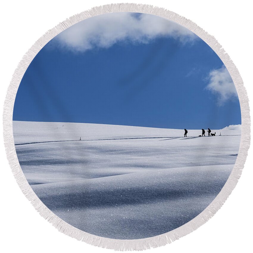 Italy Round Beach Towel featuring the photograph Hikers On Snow by Alberto Zanoni