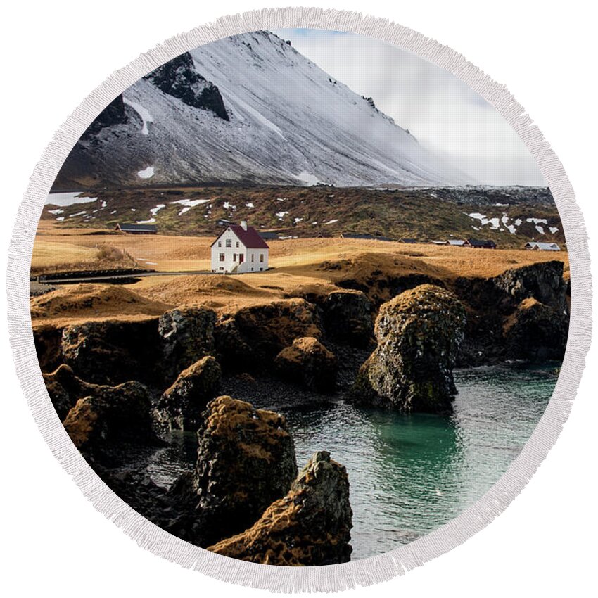 Arnarstapi Round Beach Towel featuring the photograph Iceland landscape in winter at Arnarstapi village. by Michalakis Ppalis