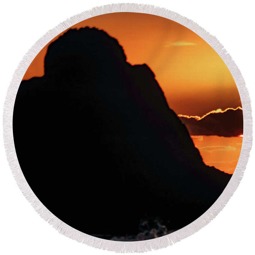 Oregon Coast Round Beach Towel featuring the photograph Large rock with sunset behind a ckoud by Jeff Swan