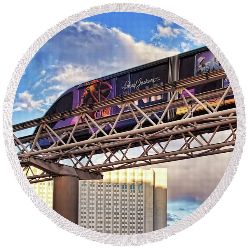 Las Vegas Monorail Round Beach Towel featuring the photograph Las Vegas Monorail riding above the city by Tatiana Travelways