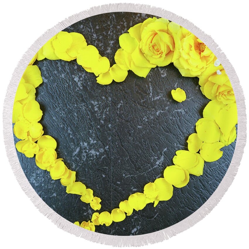 Yellow Round Beach Towel featuring the photograph Love heart border made from fresh yellow roses and petals by Milleflore Images