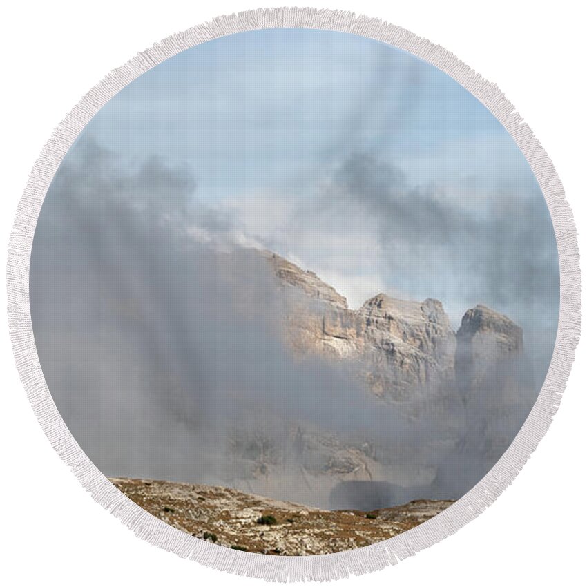 Italian Alps Round Beach Towel featuring the photograph Mountain landscape with fog in autumn. Tre Cime dolomiti Italy. by Michalakis Ppalis