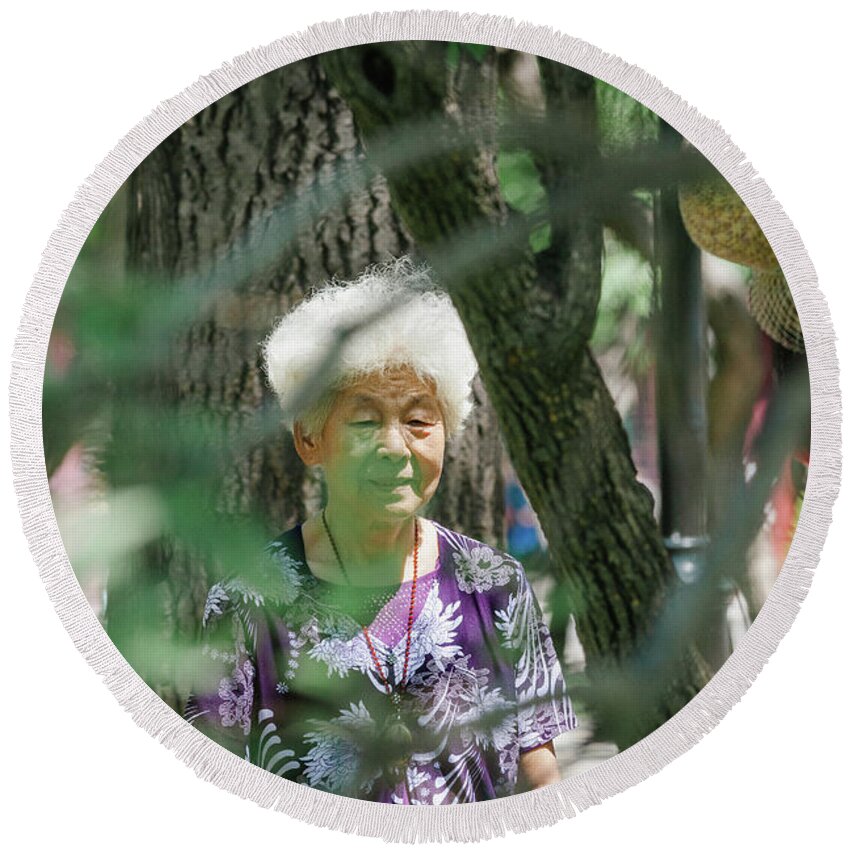 2013 Round Beach Towel featuring the photograph Old Chinese woman practicing the sylvotherapy by Benoit Bruchez