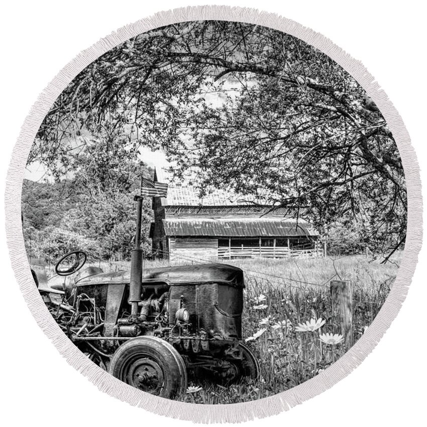 Black Round Beach Towel featuring the photograph Old Tractor in the Wildflowers Black and White by Debra and Dave Vanderlaan
