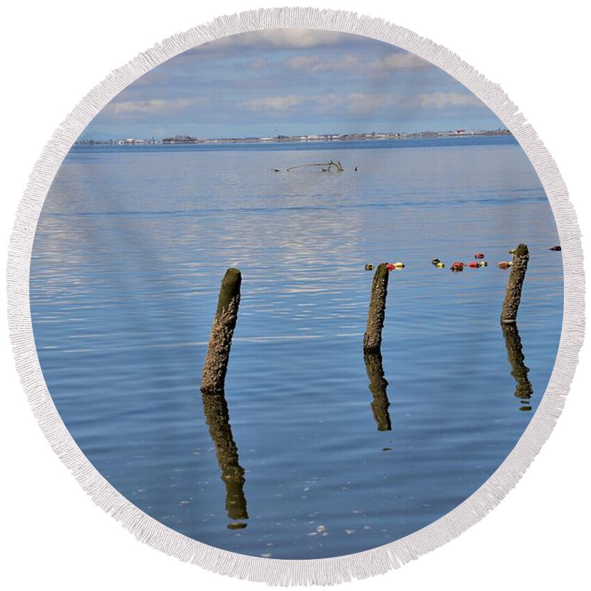 Pilings Round Beach Towel featuring the photograph Pilings in the Ocean by James Cousineau