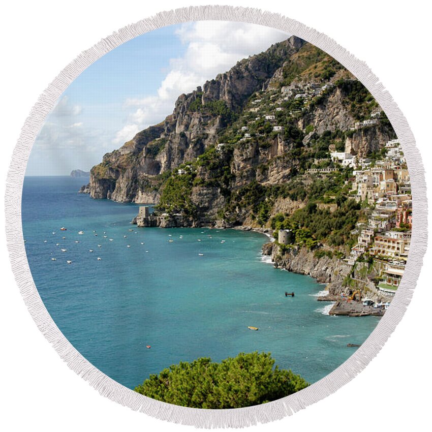  Positano Round Beach Towel featuring the photograph Positano on the Amalfi coastline with crystal blue ocean views by Gunther Allen