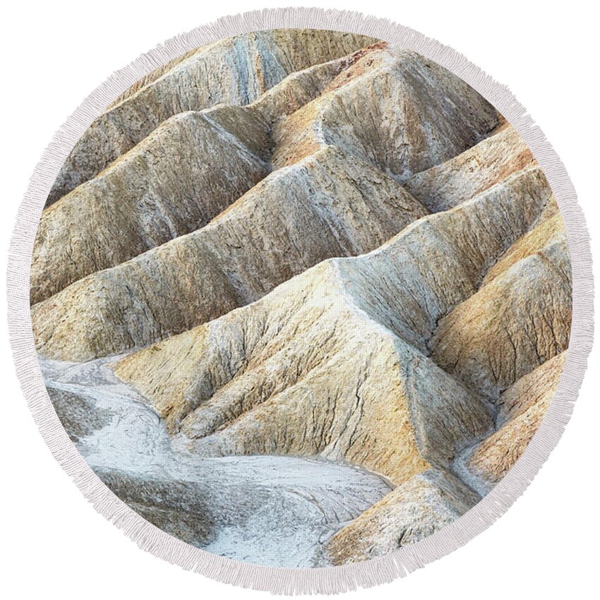 Death Valley Round Beach Towel featuring the photograph Ripples of eroded stone at Zabriskie Point, Death Valley, California. by Jane Rix