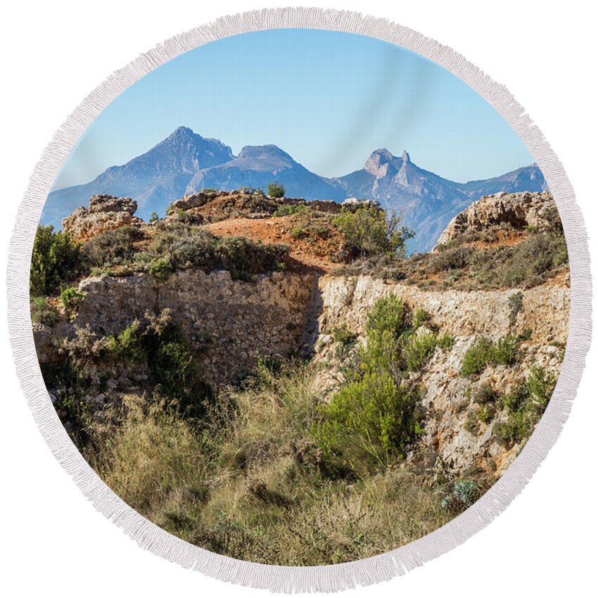 Fortress Round Beach Towel featuring the photograph Ruins of an ancient fortress in the mountains by Adriana Mueller
