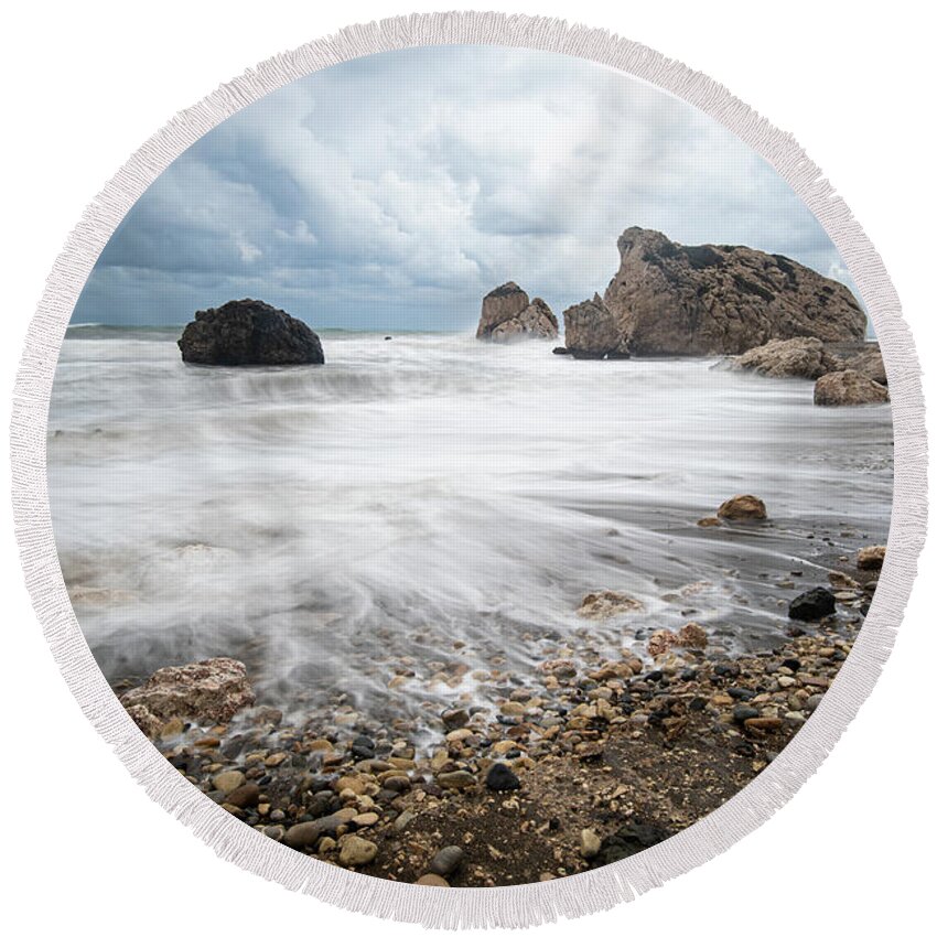 Sea Waves Round Beach Towel featuring the photograph Seascape with windy waves during stormy weather on a rocky coast by Michalakis Ppalis