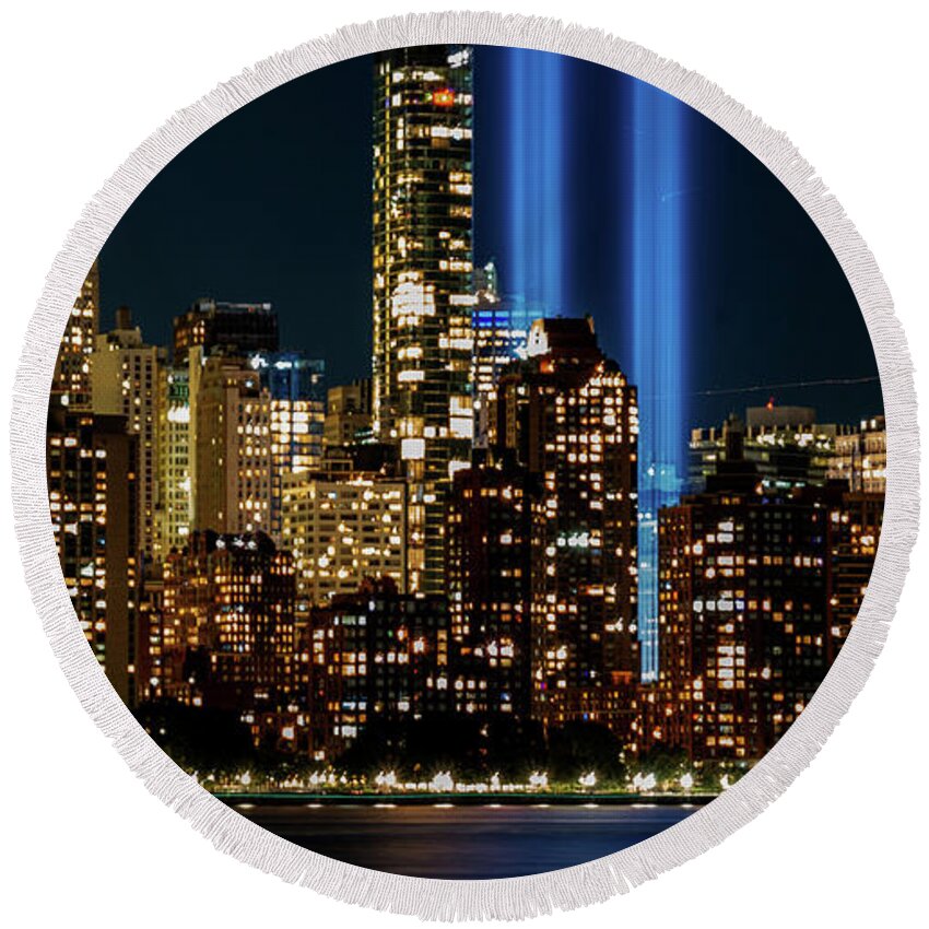 September 11 Tribute Lights Round Beach Towel featuring the photograph September 11 Tribute Lights and the Lower Manhattan Skyline by Alina Oswald