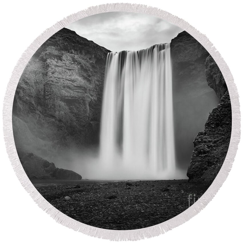 Iceland Round Beach Towel featuring the photograph Skogafoss waterfall in Iceland, black and white by Delphimages Photo Creations