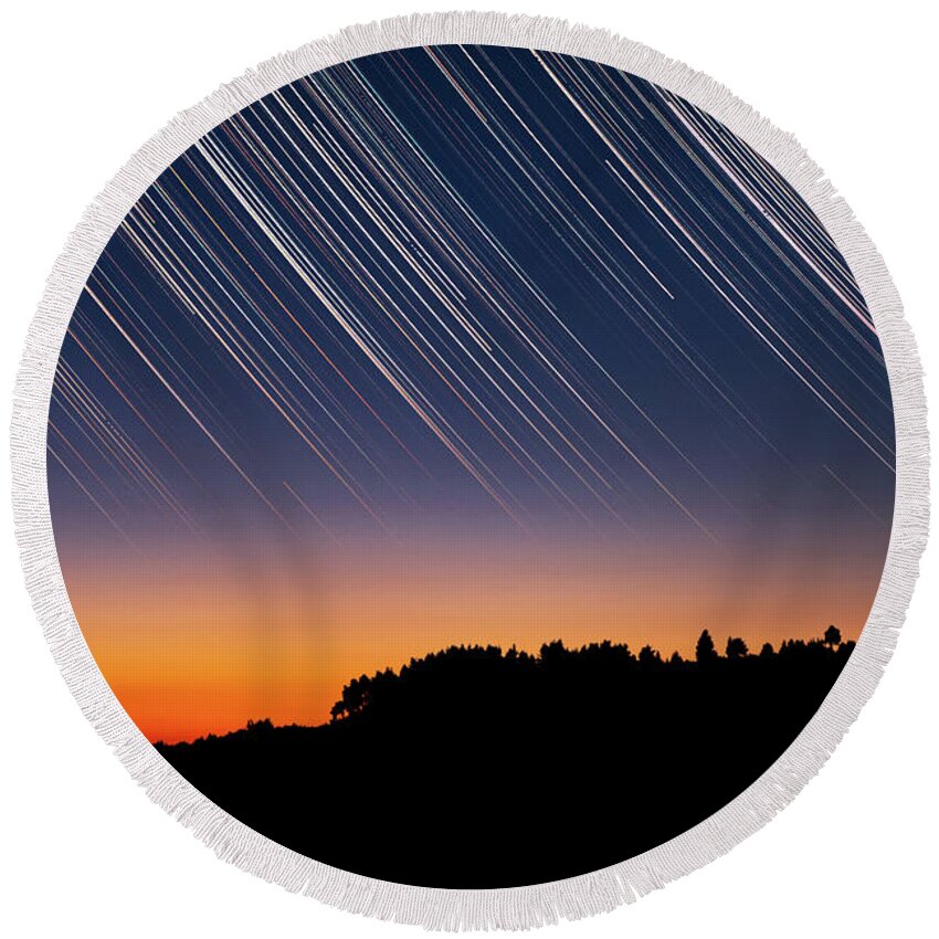 Star Trails Round Beach Towel featuring the photograph Star Trails over Tree Silhouettes by Alexios Ntounas