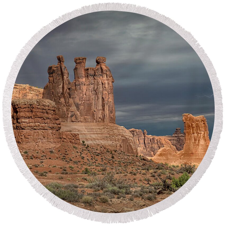 Southwest Round Beach Towel featuring the photograph Storm Over Arches National Park by Sandra Bronstein