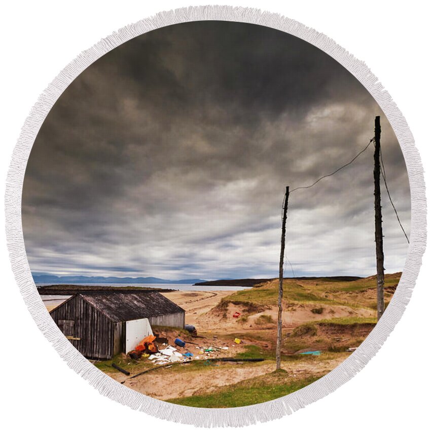 Scotland Beach Round Beach Towel featuring the photograph Stormy sky and abandoned fishing hut, Red point beach, Wester Ross, Scotland by Neale And Judith Clark