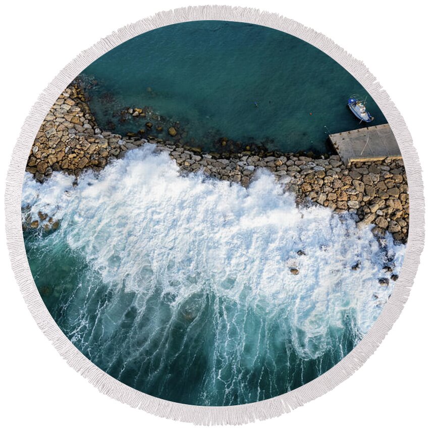 Brakewater Round Beach Towel featuring the photograph Stormy windy waves on the shore. Drone photography. by Michalakis Ppalis
