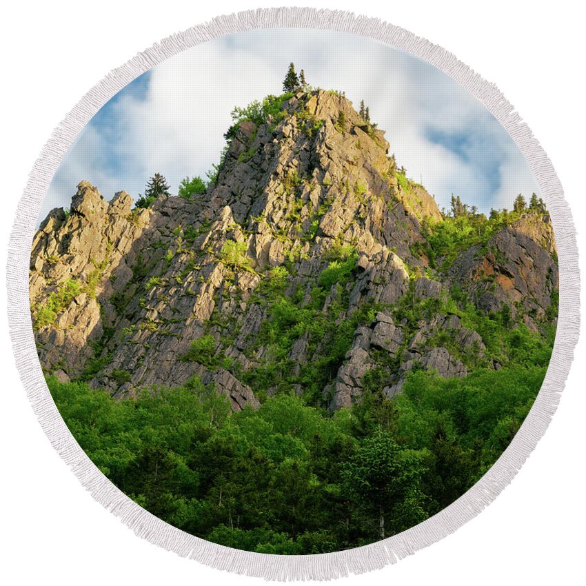 New Hampshire Round Beach Towel featuring the photograph Sunlight plays on a Stone Pinnacle in Dixville Notch, New Hampshire by William Dickman