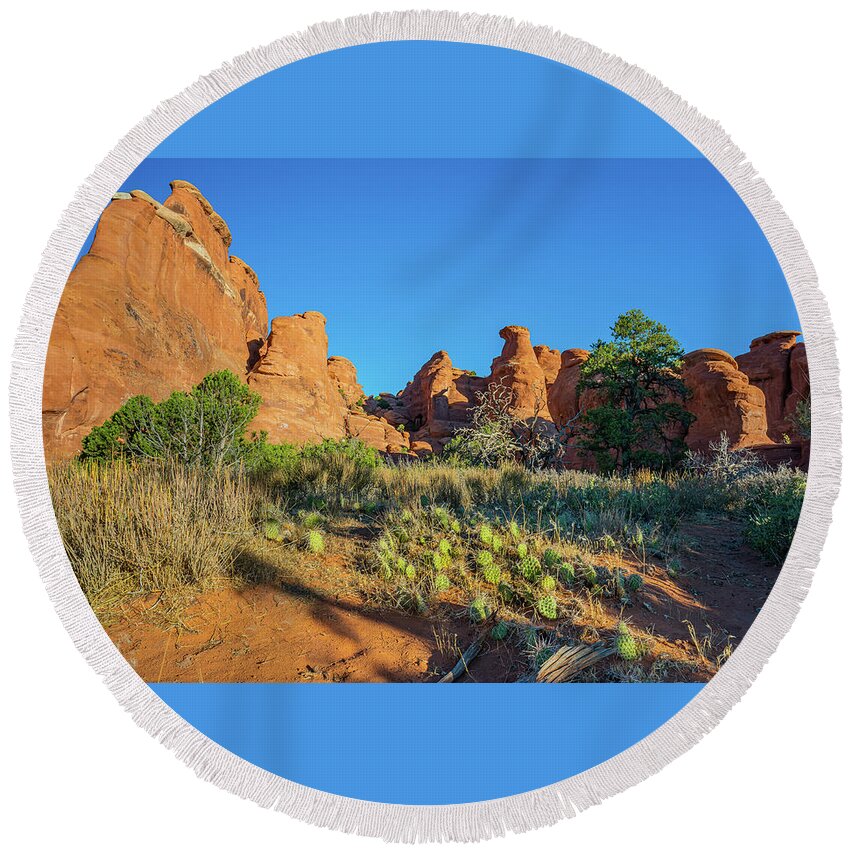 Arches National Park Round Beach Towel featuring the photograph Sunrise on Hoo Doos by Ron Long Ltd Photography